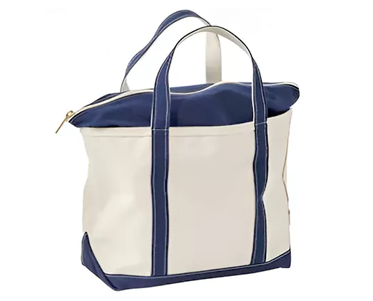 A cream-colored tote bag with navy blue handles and trim, featuring a top zipper closure.